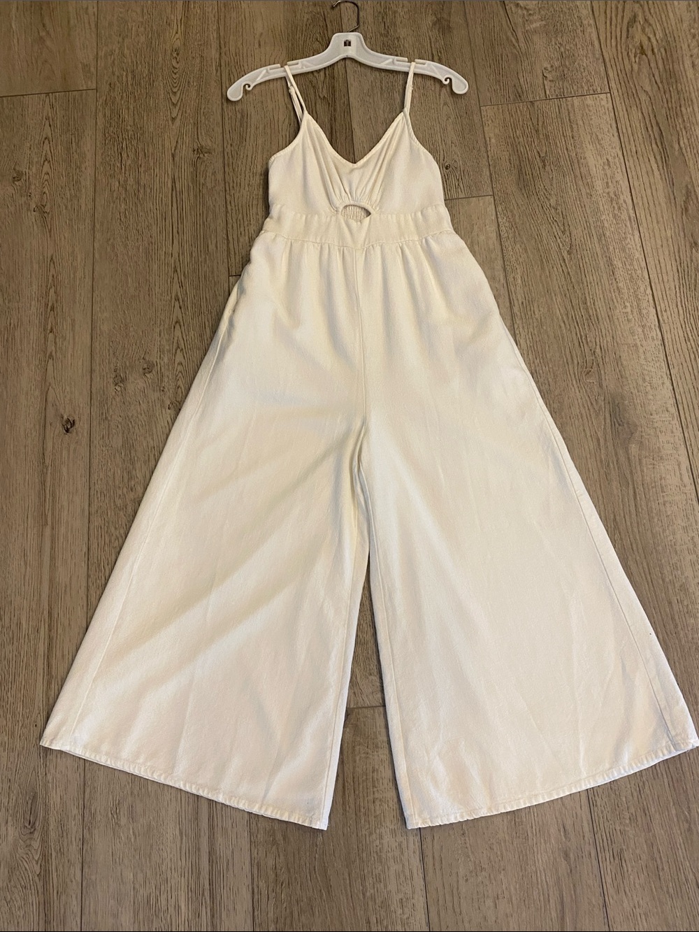 Women's White Wide-Leg Jumpsuit with adjustable Spaghetti Straps.